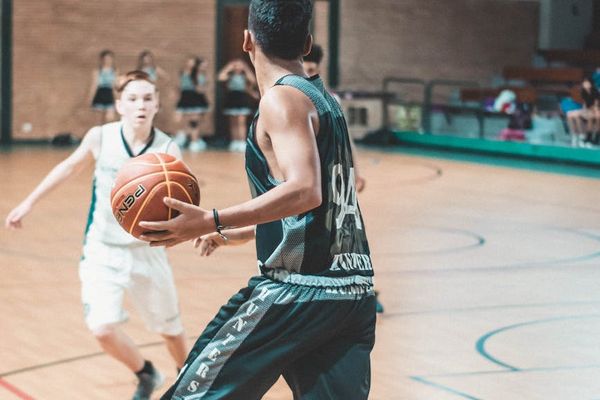 Person in mid-jump, captured with motion blur to convey energy.